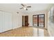 Well-lit bedroom featuring parquet flooring, closet, and French doors at 2227 Brevard Ne Rd, St Petersburg, FL 33704