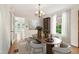 Elegant dining room featuring a chandelier, wine rack and access to other areas of the home at 2227 Brevard Ne Rd, St Petersburg, FL 33704