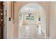 Inviting entryway showcasing tiled floors and arched openings leading to sunlit rooms at 2227 Brevard Ne Rd, St Petersburg, FL 33704