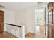 Hallway with parquet flooring and doors leading to other rooms at 2227 Brevard Ne Rd, St Petersburg, FL 33704