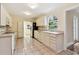 Functional kitchen features a window over the sink and tile flooring at 2227 Brevard Ne Rd, St Petersburg, FL 33704