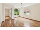 Bright room showcases wood floors and arched doorway leading to an adjacent space at 2227 Brevard Ne Rd, St Petersburg, FL 33704