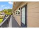 Exterior balcony view of a well-maintained apartment building showcasing modern outdoor lighting at 232 36Th N Ave # 202C, St Petersburg, FL 33704