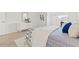Bedroom showcasing modern decor, tile floors, and a comfortable bed with stylish bedding at 232 36Th N Ave # 202C, St Petersburg, FL 33704