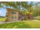 Two-story multi-Gathering building with manicured landscaping and a welcoming staircase to the units at 232 36Th N Ave # 202C, St Petersburg, FL 33704