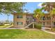 Charming two-story apartment building with well-maintained landscaping and a welcoming entrance at 232 36Th N Ave # 202C, St Petersburg, FL 33704