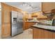 Well-equipped kitchen with stainless steel appliances, ample wood cabinetry, and decorative backsplash at 232 36Th N Ave # 202C, St Petersburg, FL 33704