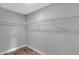 A closet area with wire shelving and wood-look flooring at 23440 Corinne Ave, Port Charlotte, FL 33980