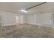 Spacious, unfinished garage with concrete floor and white walls at 23440 Corinne Ave, Port Charlotte, FL 33980