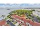 Beautiful aerial view of townhomes with red tile roofs near waterfront and lush green trees at 2700 Bayshore Blvd # 497, Dunedin, FL 34698