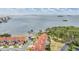 Aerial view of the community with lush trees and view of the bay at 2700 Bayshore Blvd # 497, Dunedin, FL 34698