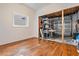 Bonus room with wood flooring, a window and garage access at 2700 Bayshore Blvd # 497, Dunedin, FL 34698