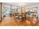 Open-concept dining room with wood floors and mirror, flowing into the living and kitchen areas at 2700 Bayshore Blvd # 497, Dunedin, FL 34698