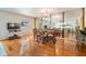 Elegant dining room with hardwood floors, dining set, and large mirror wall at 2700 Bayshore Blvd # 497, Dunedin, FL 34698