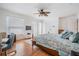 Bright main bedroom with hardwood floors, fan, and multiple windows for natural light at 2700 Bayshore Blvd # 497, Dunedin, FL 34698