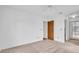 Spacious bedroom features neutral walls and carpet and mirrored closet doors at 2749 Countryside Blvd # 20, Clearwater, FL 33761