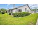 A bright exterior view showcases well-maintained landscaping, enhancing the home's curb appeal at 2749 Countryside Blvd # 20, Clearwater, FL 33761