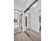 Hallway features mirrored closets leading to a bedroom and bathroom at 2749 Countryside Blvd # 20, Clearwater, FL 33761