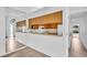 Well-lit kitchen with a breakfast bar and ample cabinet space at 2749 Countryside Blvd # 20, Clearwater, FL 33761
