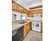 Functional kitchen featuring essential appliances and abundant countertop space at 2749 Countryside Blvd # 20, Clearwater, FL 33761