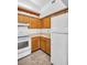 Efficient kitchen design with a refrigerator and a range at 2749 Countryside Blvd # 20, Clearwater, FL 33761