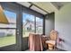 Relaxing screened-in lanai with views of the well-maintained lawn and neighboring home at 2749 Countryside Blvd # 20, Clearwater, FL 33761