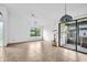 Spacious living room boasting tile flooring, bright windows, and sliding glass doors at 2749 Countryside Blvd # 20, Clearwater, FL 33761