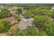 Aerial view of home nestled among mature trees, showcasing its prime location within the neighborhood at 2901 Laurel Meadow Ct, Plant City, FL 33566