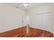 Clean bedroom featuring hardwood floors, double closets and a full view of entry door at 2901 Laurel Meadow Ct, Plant City, FL 33566