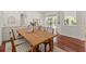 Well-appointed dining space with hardwood floors and seamless access to the living area and pool view at 2901 Laurel Meadow Ct, Plant City, FL 33566