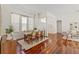 Dining room with an open layout, hardwood floors, and natural light from the windows at 2901 Laurel Meadow Ct, Plant City, FL 33566