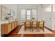 Bright dining room with a modern light fixture and a built-in cabinet at 2901 Laurel Meadow Ct, Plant City, FL 33566