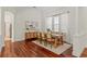 Dining room with modern decor, beautiful wood floors, and ample natural lighting at 2901 Laurel Meadow Ct, Plant City, FL 33566