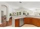 Bright kitchen featuring stainless steel appliances, a breakfast bar, and ample natural light at 2901 Laurel Meadow Ct, Plant City, FL 33566