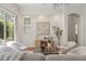 Cozy living room with stylish furniture, a decorative cabinet, and a view of the outdoor pool at 2901 Laurel Meadow Ct, Plant City, FL 33566