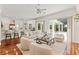 Inviting living room with a cozy seating arrangement and sliding glass doors to the patio at 2901 Laurel Meadow Ct, Plant City, FL 33566
