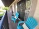 Relaxing balcony area complete with seating, a small table, and a grill at 2935 Lichen Ln # D, Clearwater, FL 33760