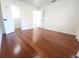 Bright and airy bedroom featuring hardwood floors and a walk-in closet for ample storage at 2935 Lichen Ln # D, Clearwater, FL 33760