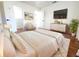 Staged main bedroom features modern decor, hardwood flooring, and a view of the walk-in closet at 2935 Lichen Ln # D, Clearwater, FL 33760