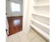 Walk-in closet with built in shelving located next to the bedroom at 2935 Lichen Ln # D, Clearwater, FL 33760