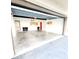 Spacious garage featuring ample storage space, white walls, and a clean concrete floor at 2935 Lichen Ln # D, Clearwater, FL 33760