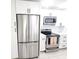 Modern kitchen boasts stainless steel appliances, white cabinets, and a neutral color scheme at 2935 Lichen Ln # D, Clearwater, FL 33760