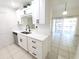 Modern kitchen featuring white cabinets, stainless steel appliances, and open floor plan at 2935 Lichen Ln # D, Clearwater, FL 33760