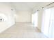 Spacious living room with neutral paint, tile floors, and bright natural light at 2935 Lichen Ln # D, Clearwater, FL 33760