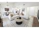 Bright and airy living room featuring a white sectional, tile floors, and soaring ceilings at 2935 Lichen Ln # D, Clearwater, FL 33760