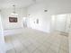 Open-concept living area featuring tile flooring, high ceilings, and seamless access to kitchen at 2935 Lichen Ln # D, Clearwater, FL 33760