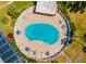 Aerial view of a kidney bean-shaped community pool and lounge area at 2935 Lichen Ln # D, Clearwater, FL 33760