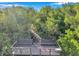 Wooden dock in wooded area overlooking a body of water at 2935 Lichen Ln # D, Clearwater, FL 33760