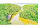 Picturesque aerial view of the river, showing Florida foliage surrounding the river at 2935 Lichen Ln # D, Clearwater, FL 33760
