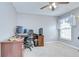Office setup in bedroom with desk, chair, computer, and ceiling fan at 3012 Magnolia Meadows Dr, Plant City, FL 33567